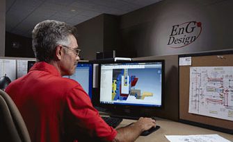 An EnG engineer working on a tooling model at his workstation